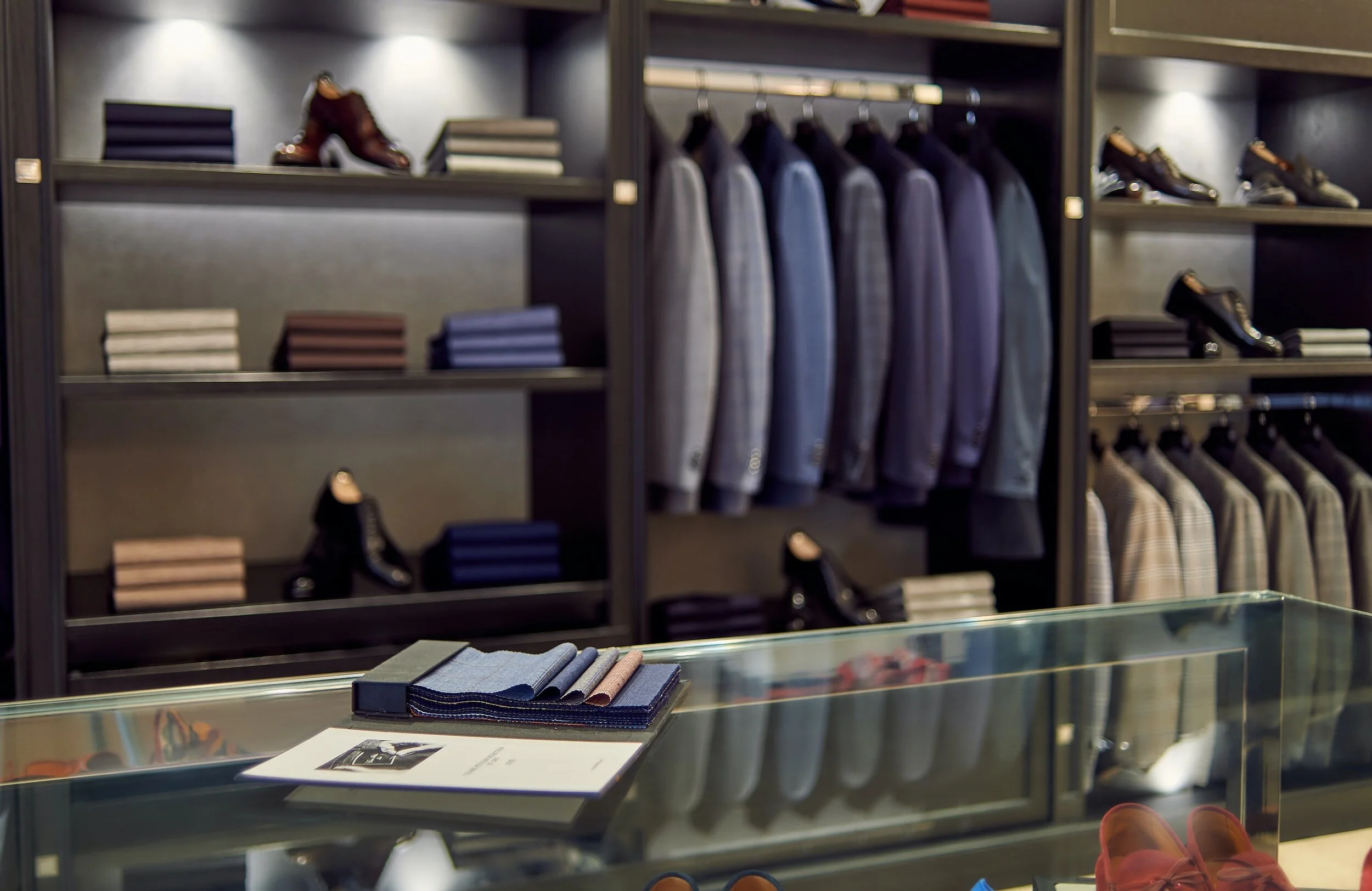 Expansive luxury walk-in wardrobe with boutique-style shelving and specialised drawer units