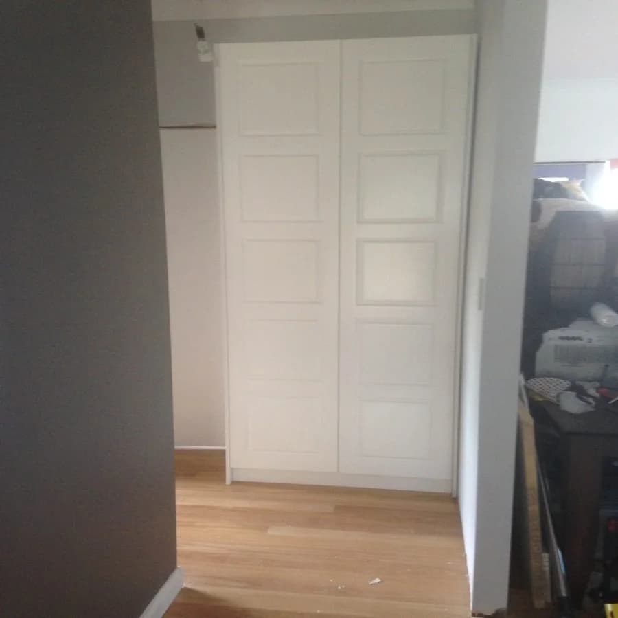 Elegant white hinged door wardrobe with shaker panelling